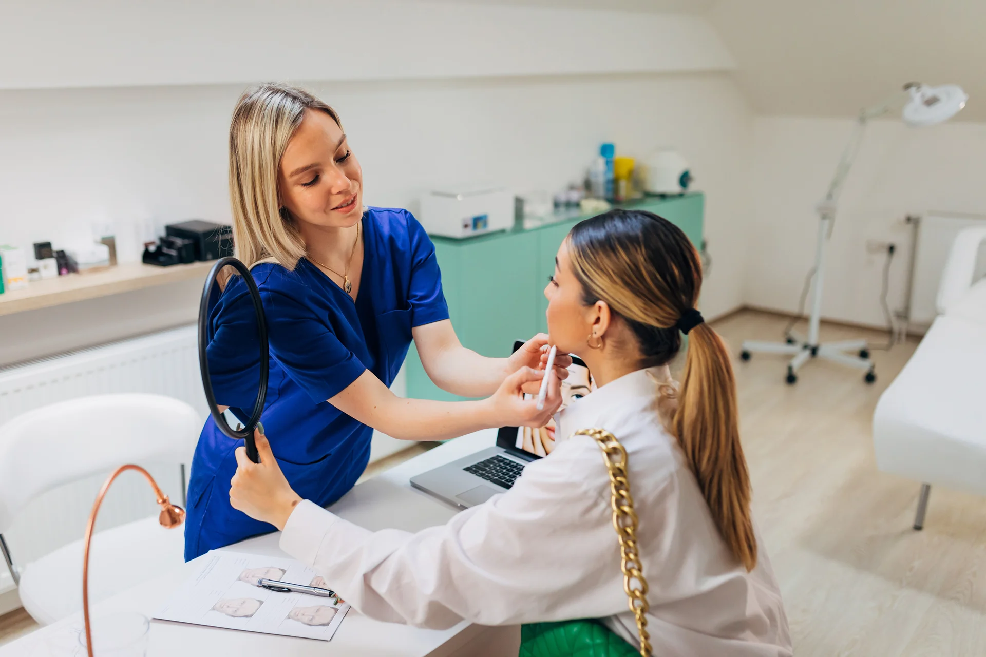 Medical provider and patient consultation about cheek filler procedure||