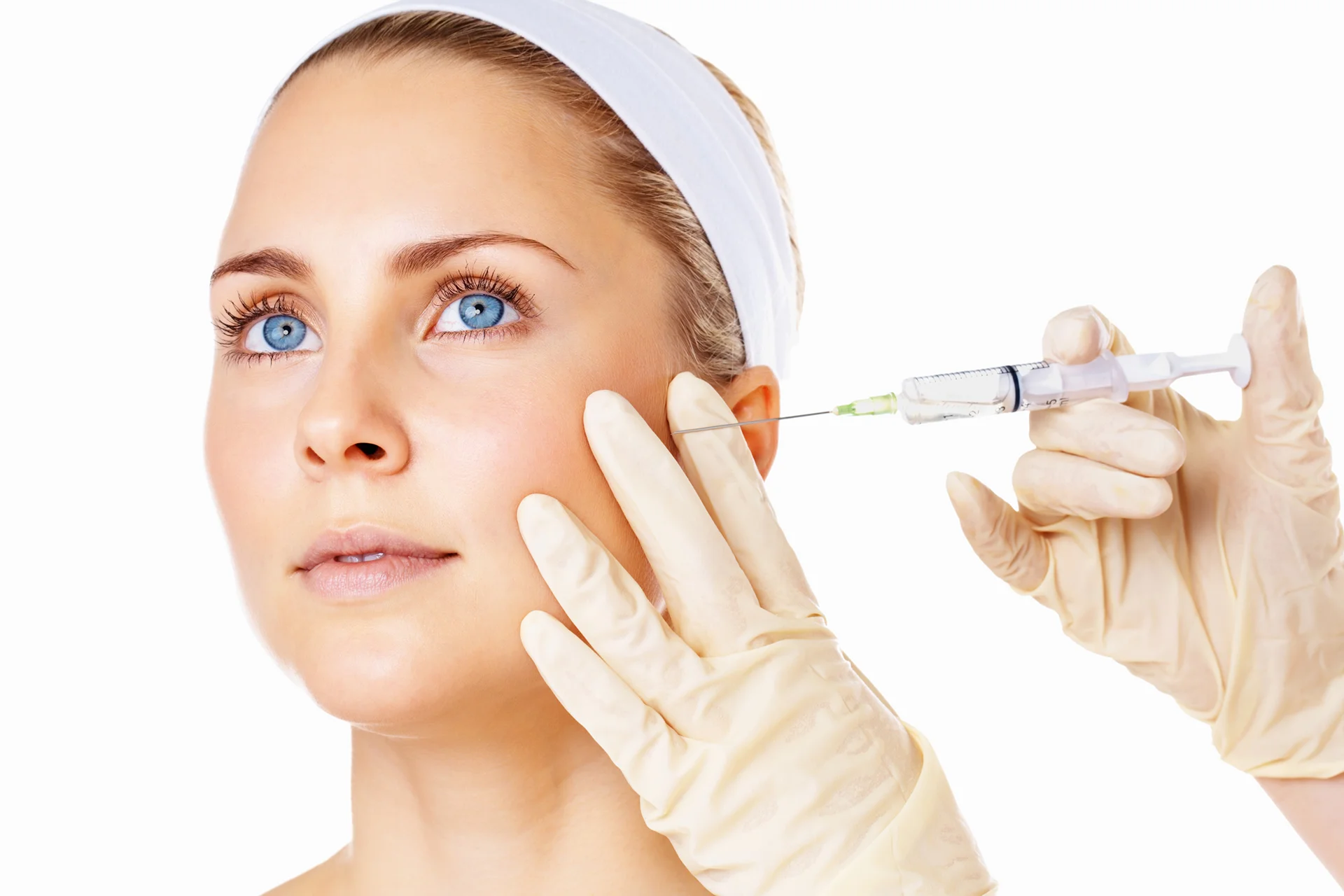 a woman getting cheek filler treatment|||