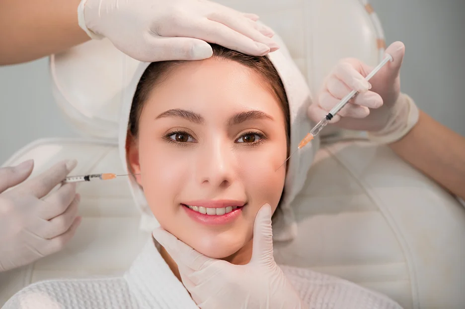 a smiling woman underwent cheek filler procedure