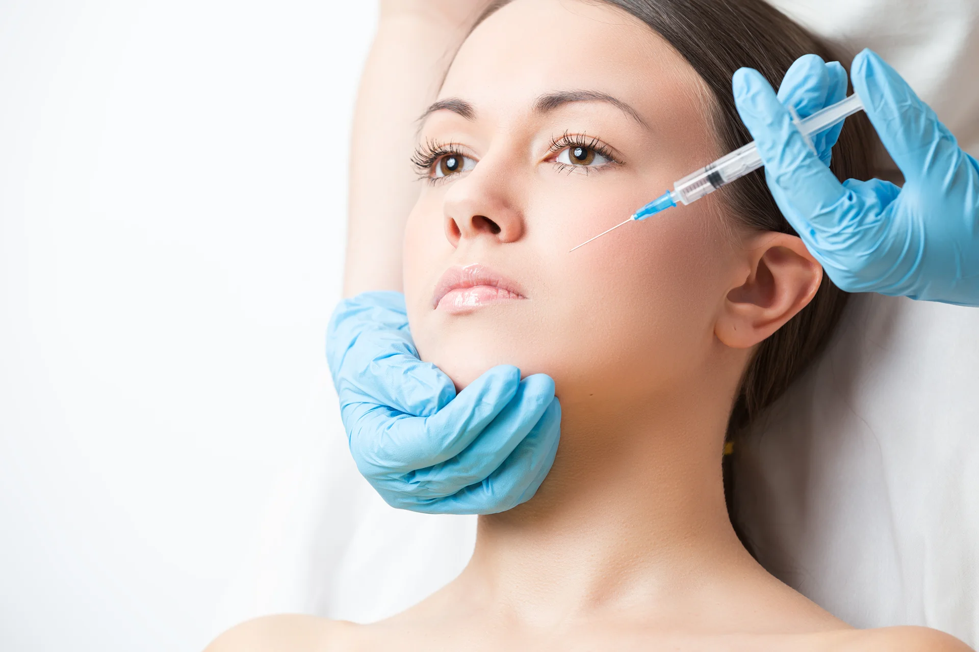 A woman getting cheek fillers||