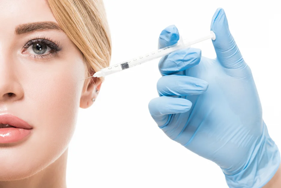 a woman having cheek filler treatment