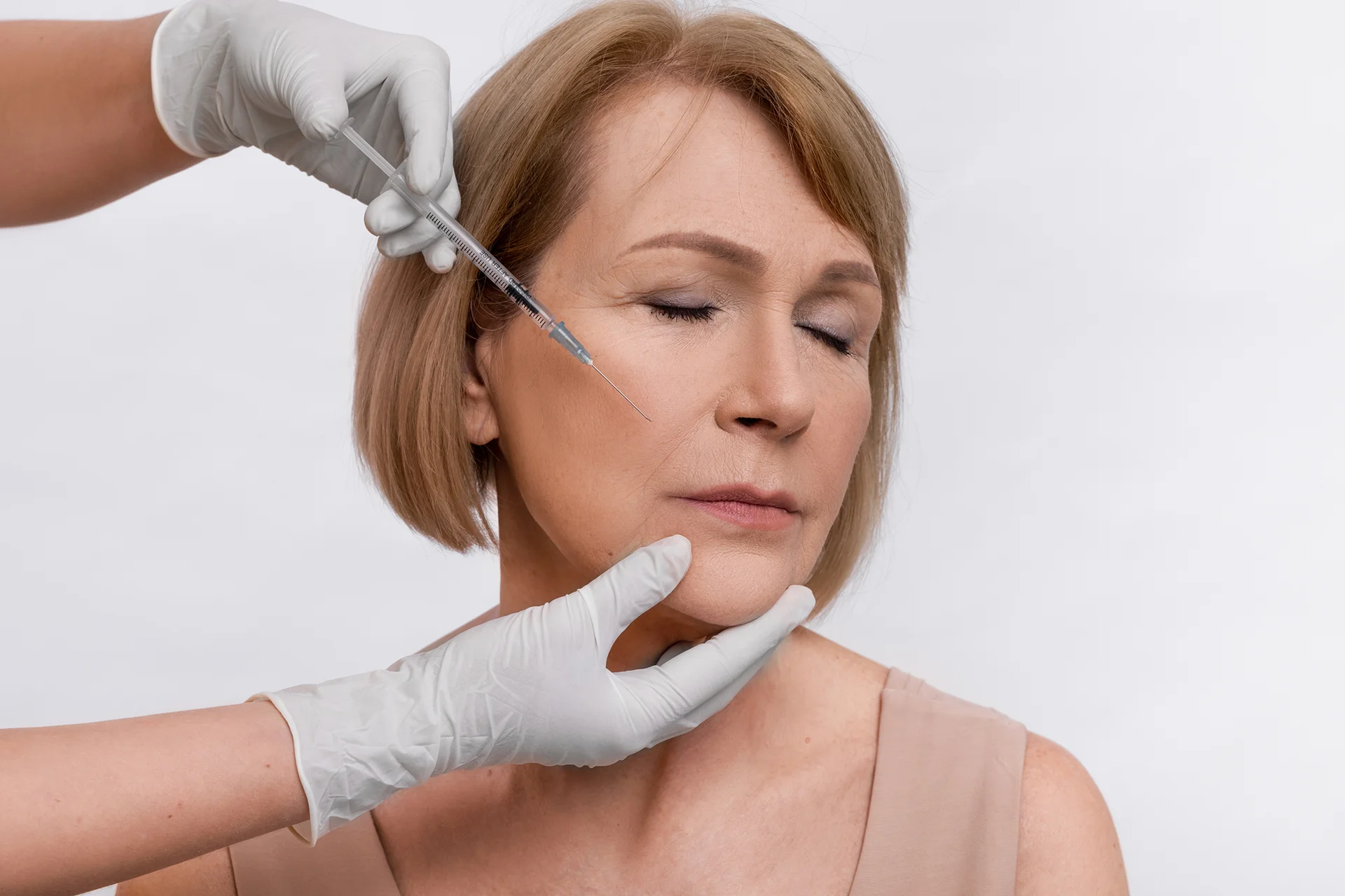 A Woman Getting Cheek Filler Treatment||