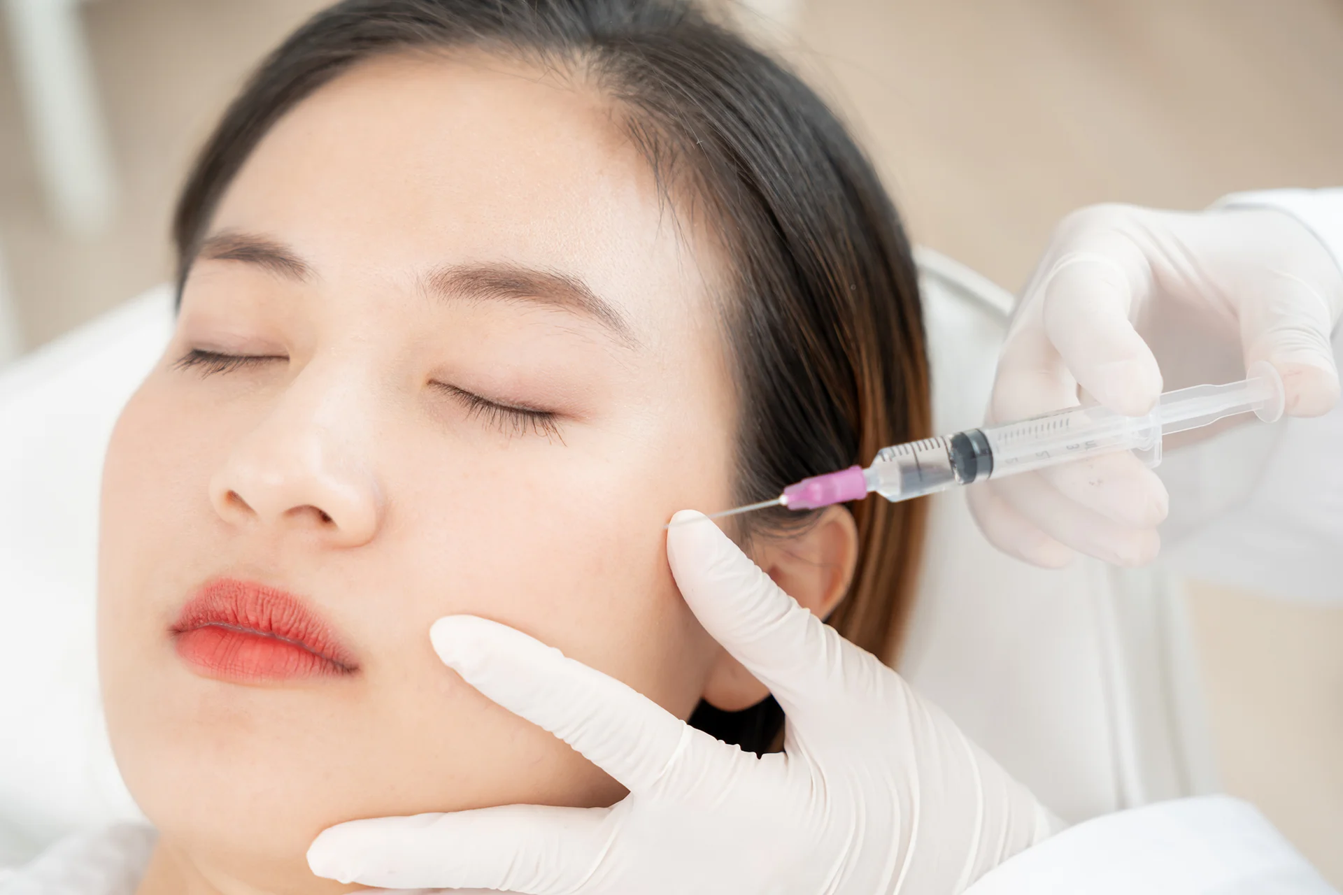 A woman getting cheek fillers|||