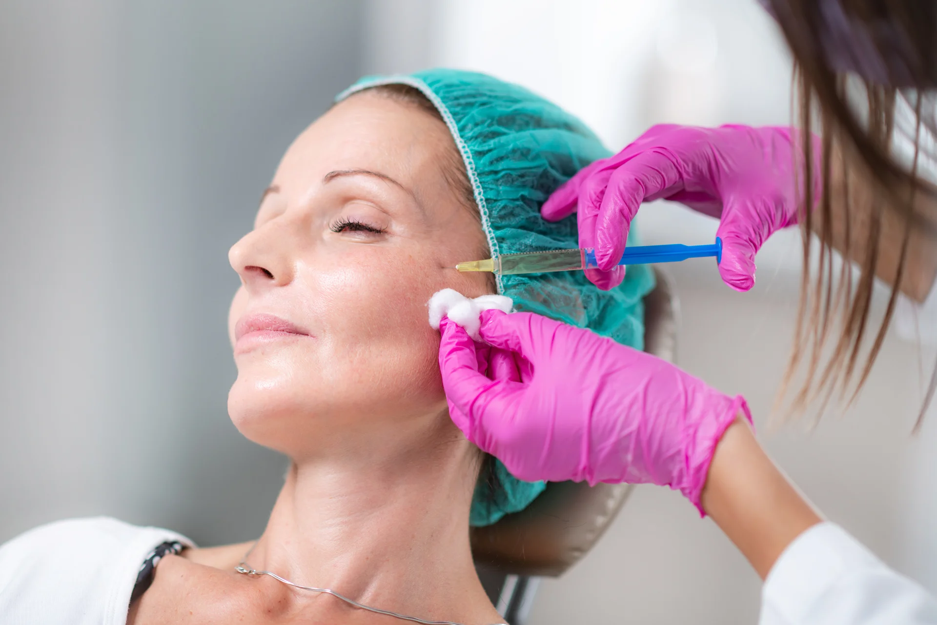 a woman getting cheek filler||