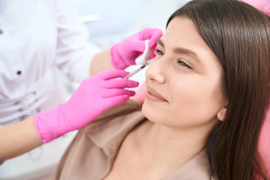 A woman getting cheek fillers