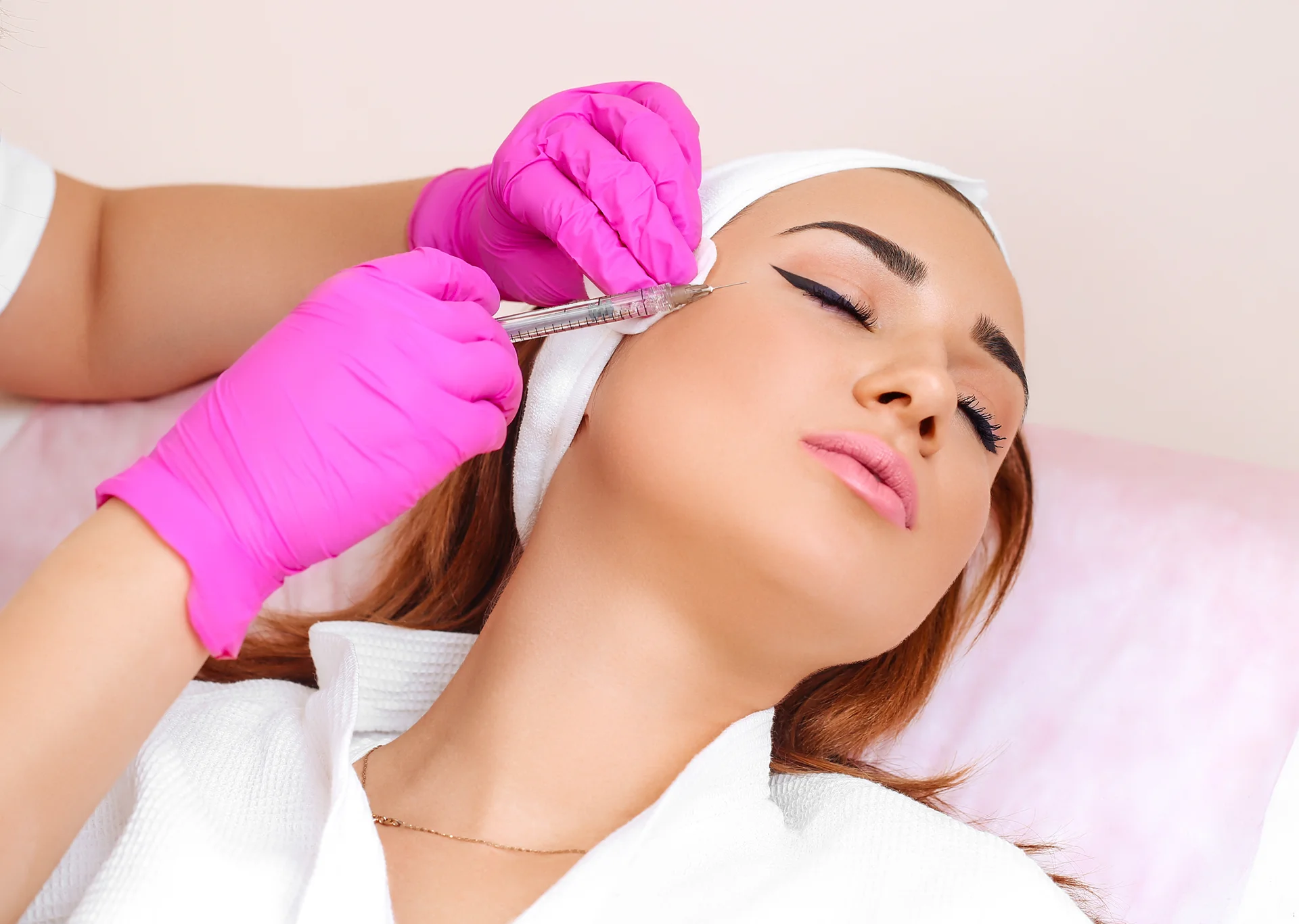 A woman getting cheek fillers|||