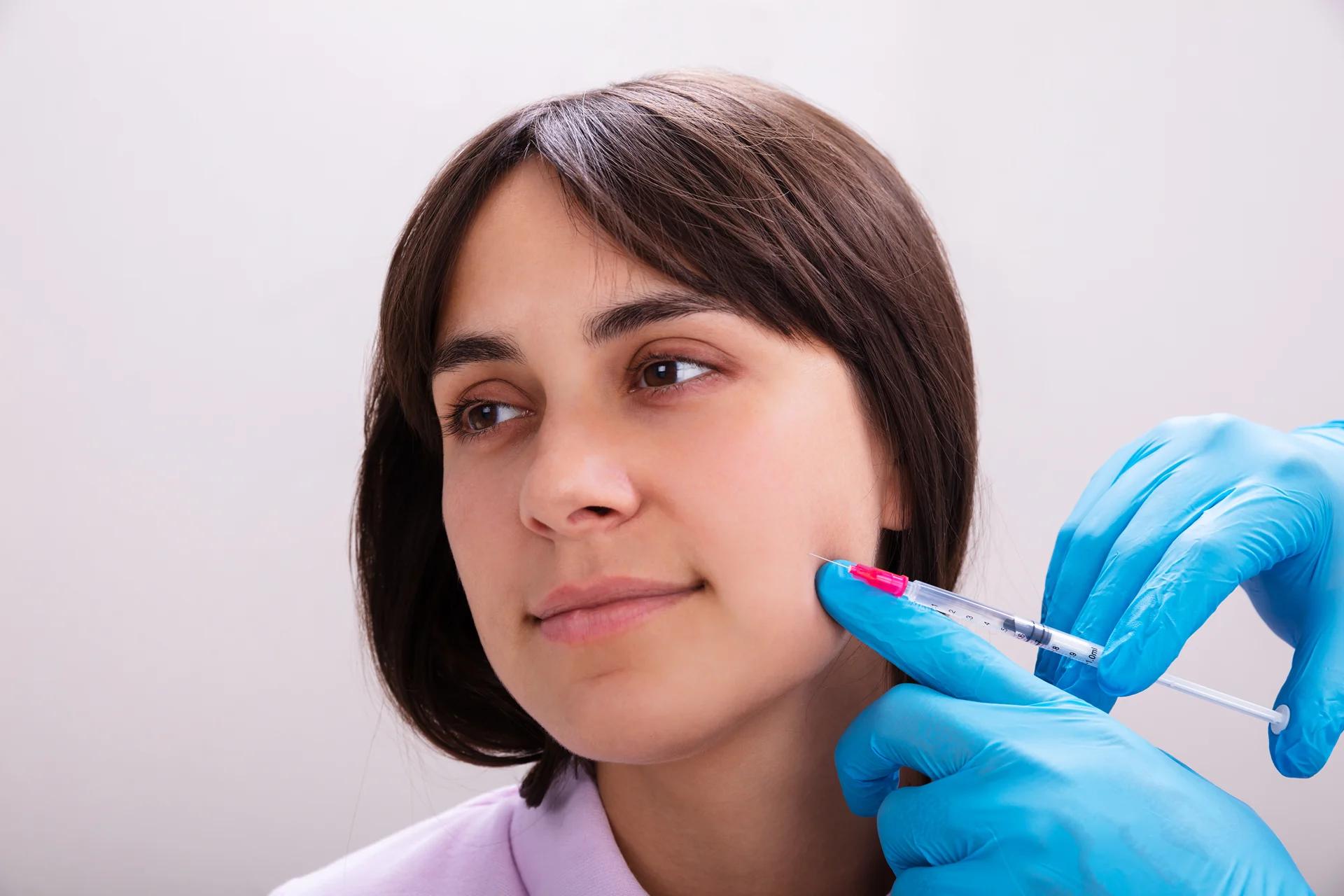 A woman having cheek fillers|||