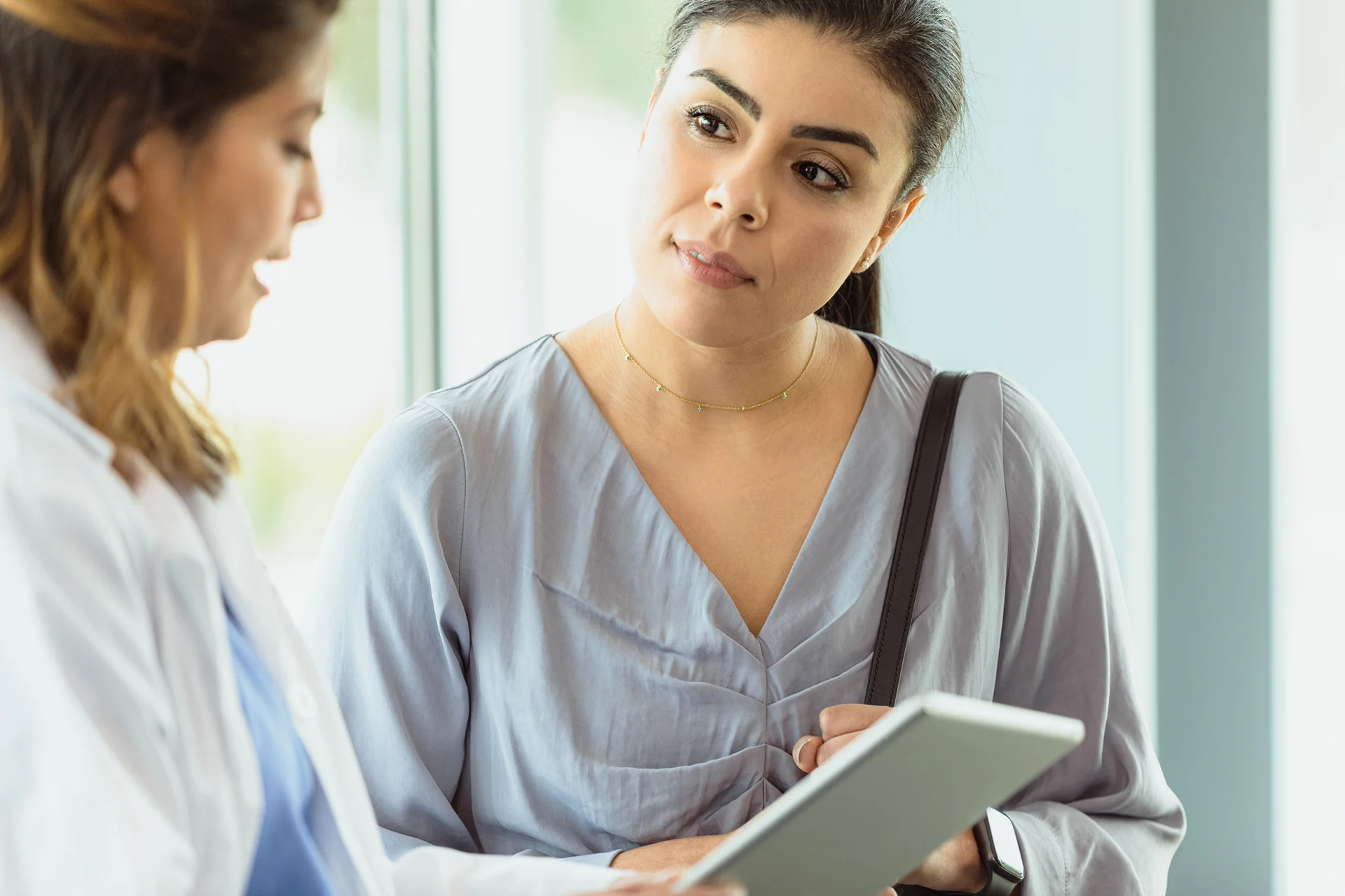 a woman consults with the medical provider before cheek filler procedure|woman receives cheek filler injection to enhance her beauty at Dr. Lanna's clinic