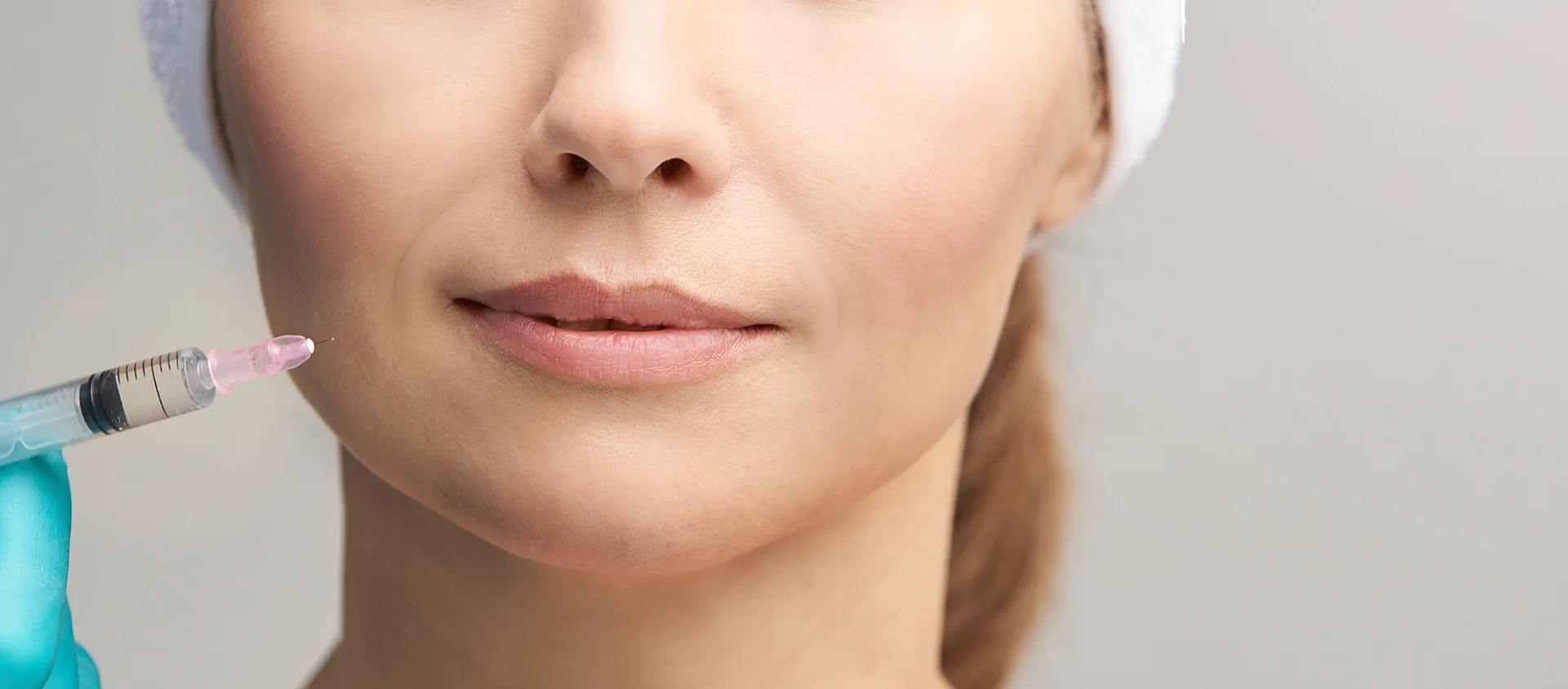a woman getting cheek fillers||