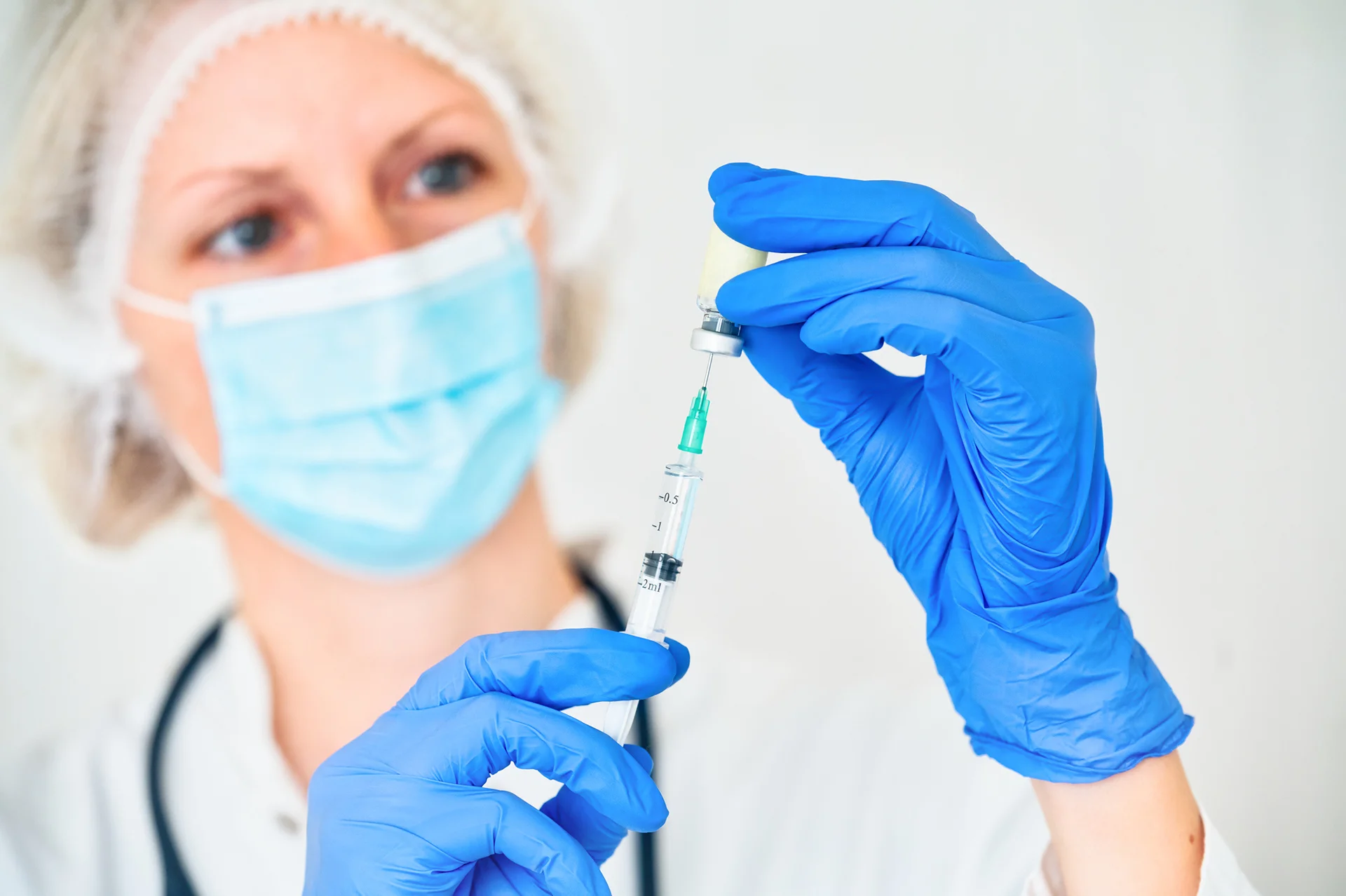 doctor holds cheek filler injection|woman had cheek filler procedure in a beauty clinic