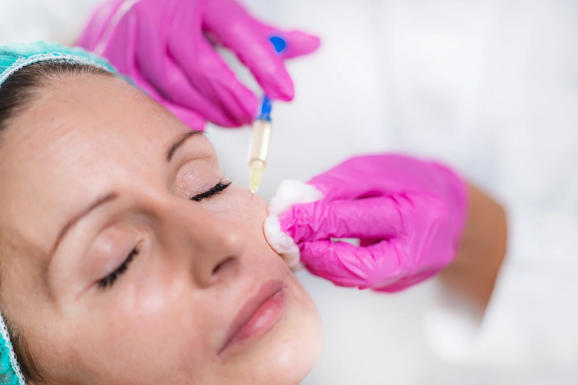 middle aged woman went to have a cheek filler treatment|woman undergoes cheek fillers procedure