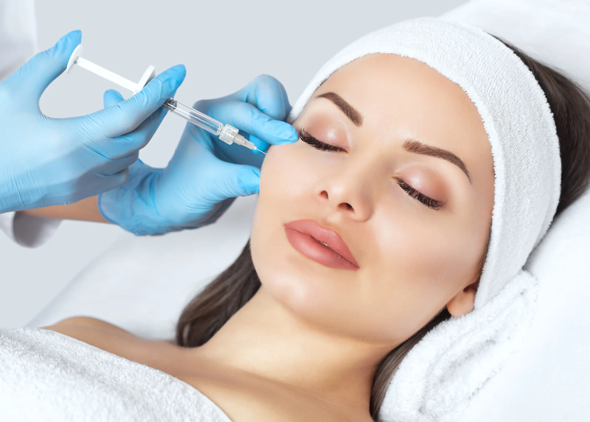 A woman getting cheek filler||