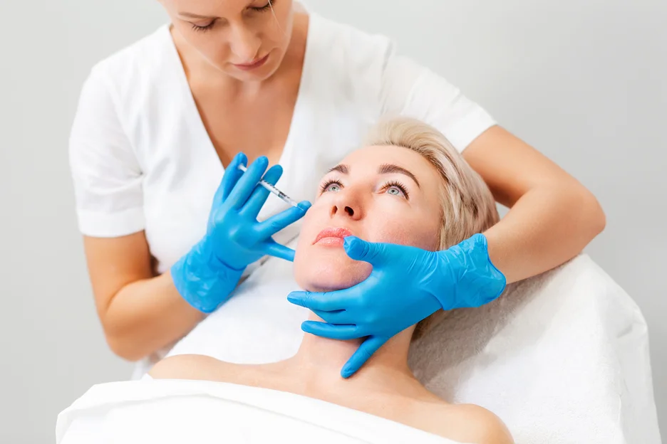 woman received cheek filler injection from a medical provider