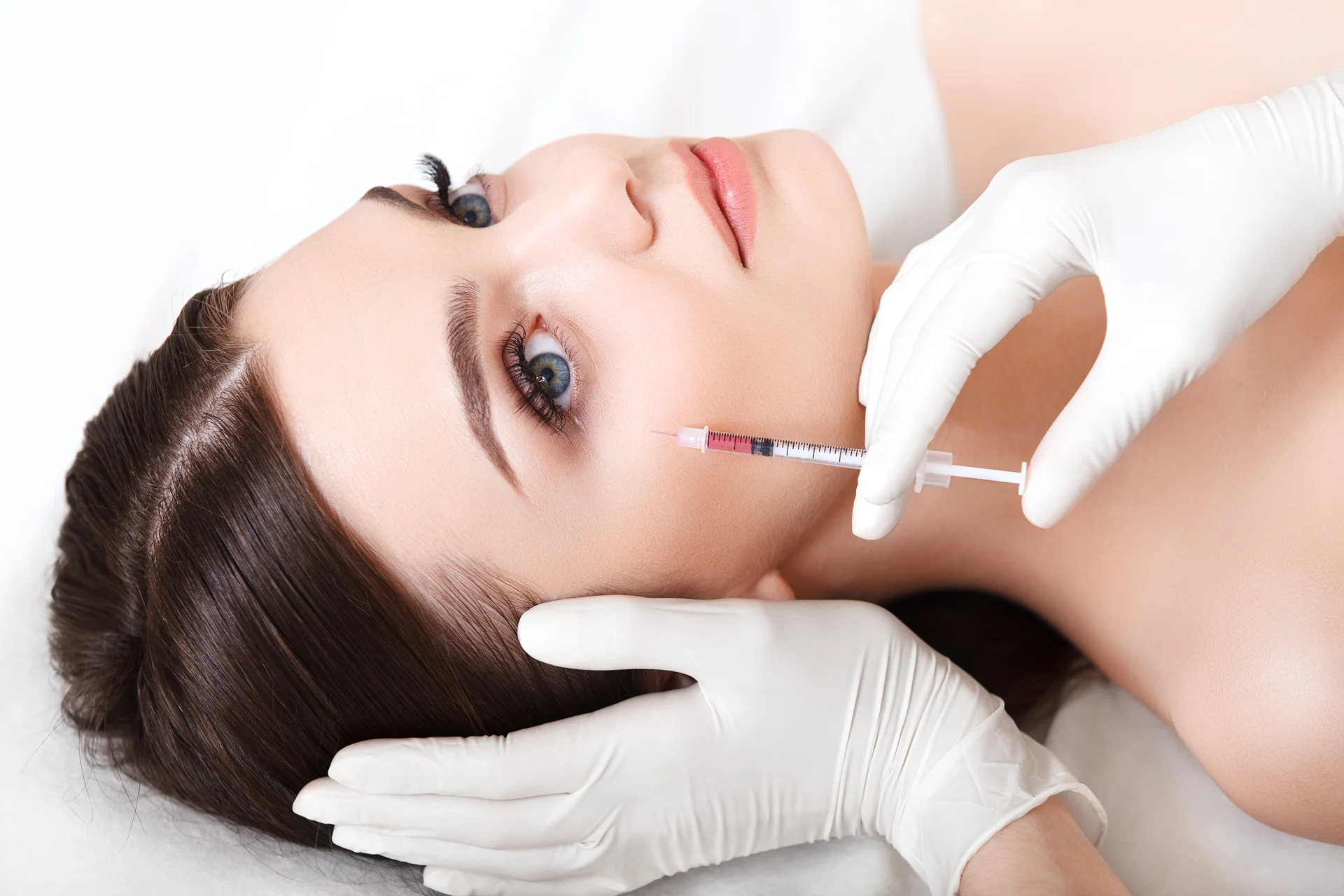 a woman getting cheek fillers||
