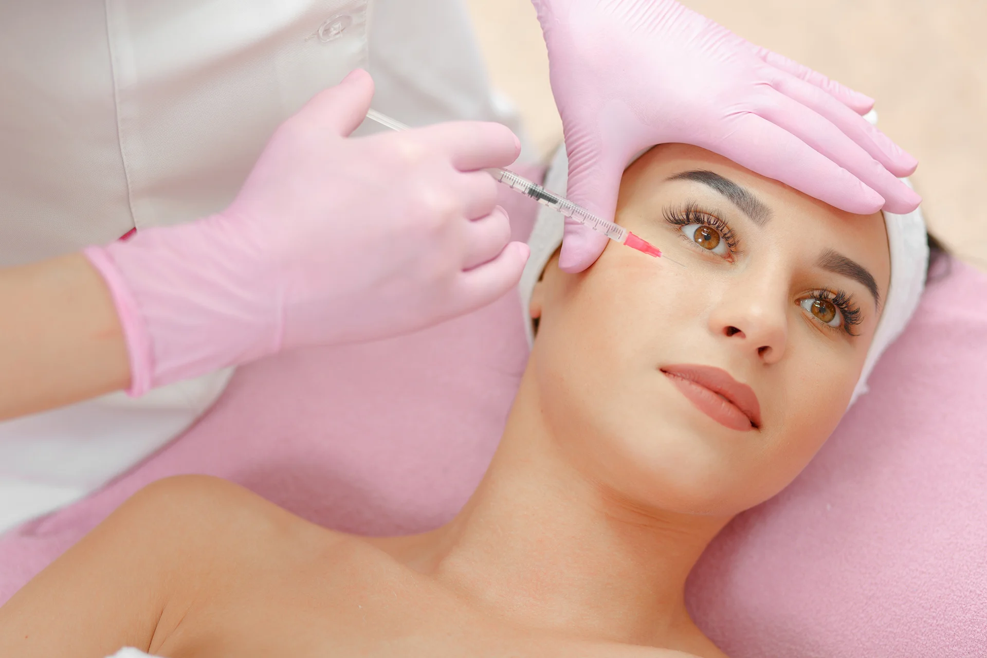 a woman had dermal filler treatment in her eyes||