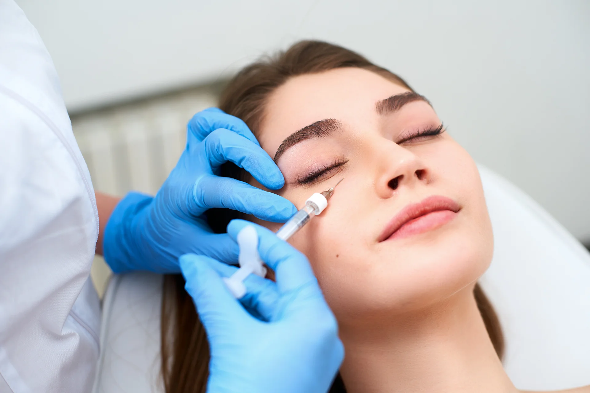 a woman received under eye dermal filler treatment||a matured woman received under eye filler treatment at Dr. Lanna's clinic