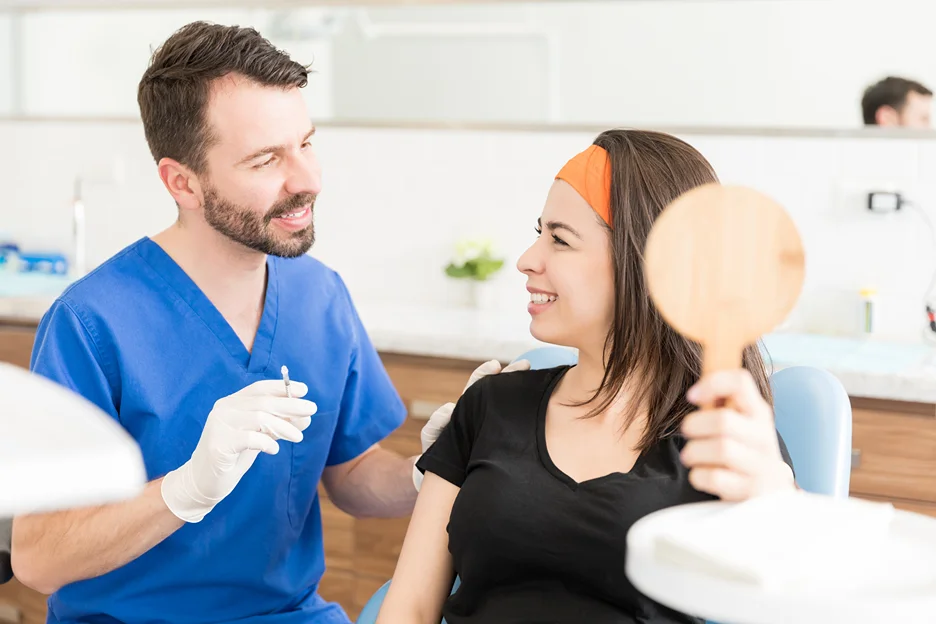 woman consults her dermal filler provider with regards to the procedure 
