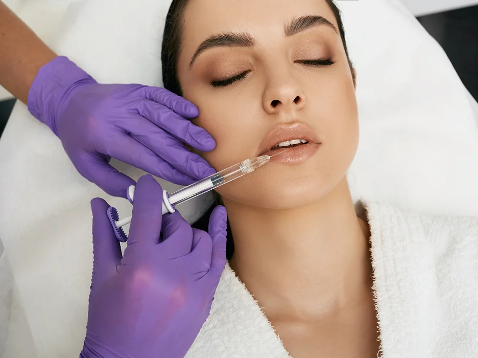 a woman underwent dermal filler treatment on her lips