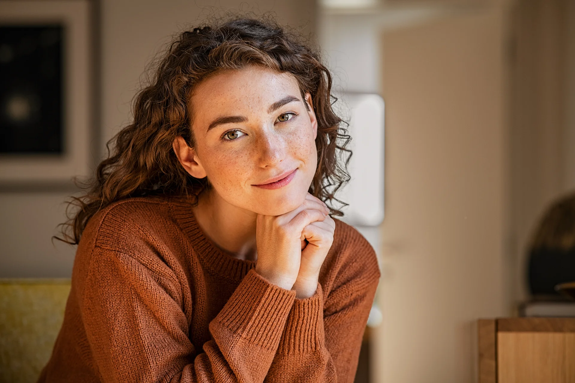 a portrait of a smiling young woman||