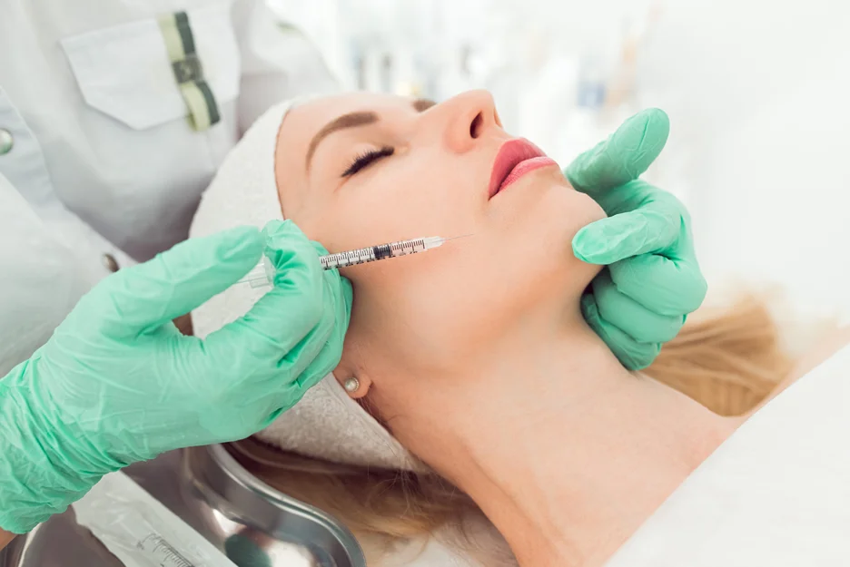 A woman getting cheek filler