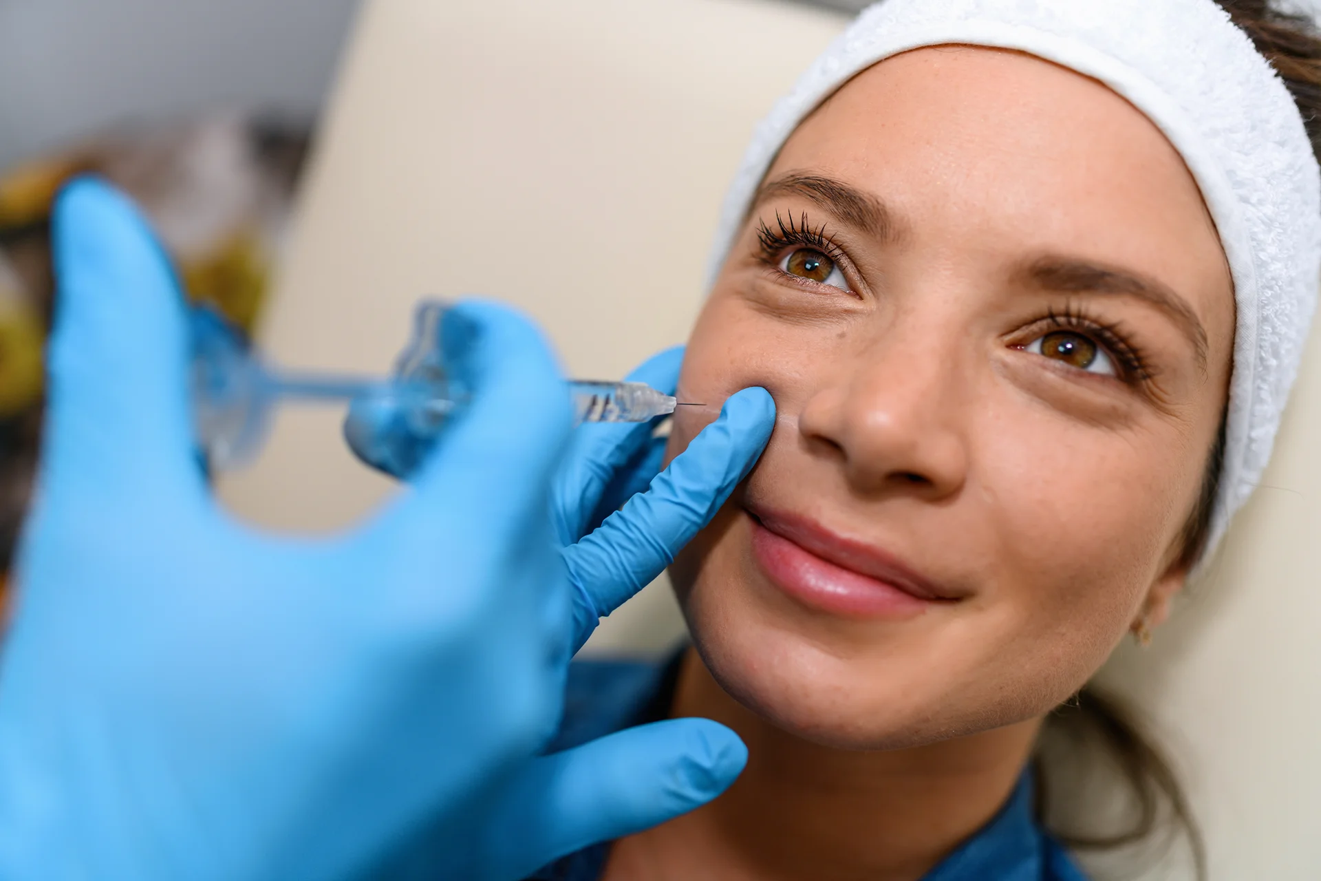 A woman getting cheek fillers||