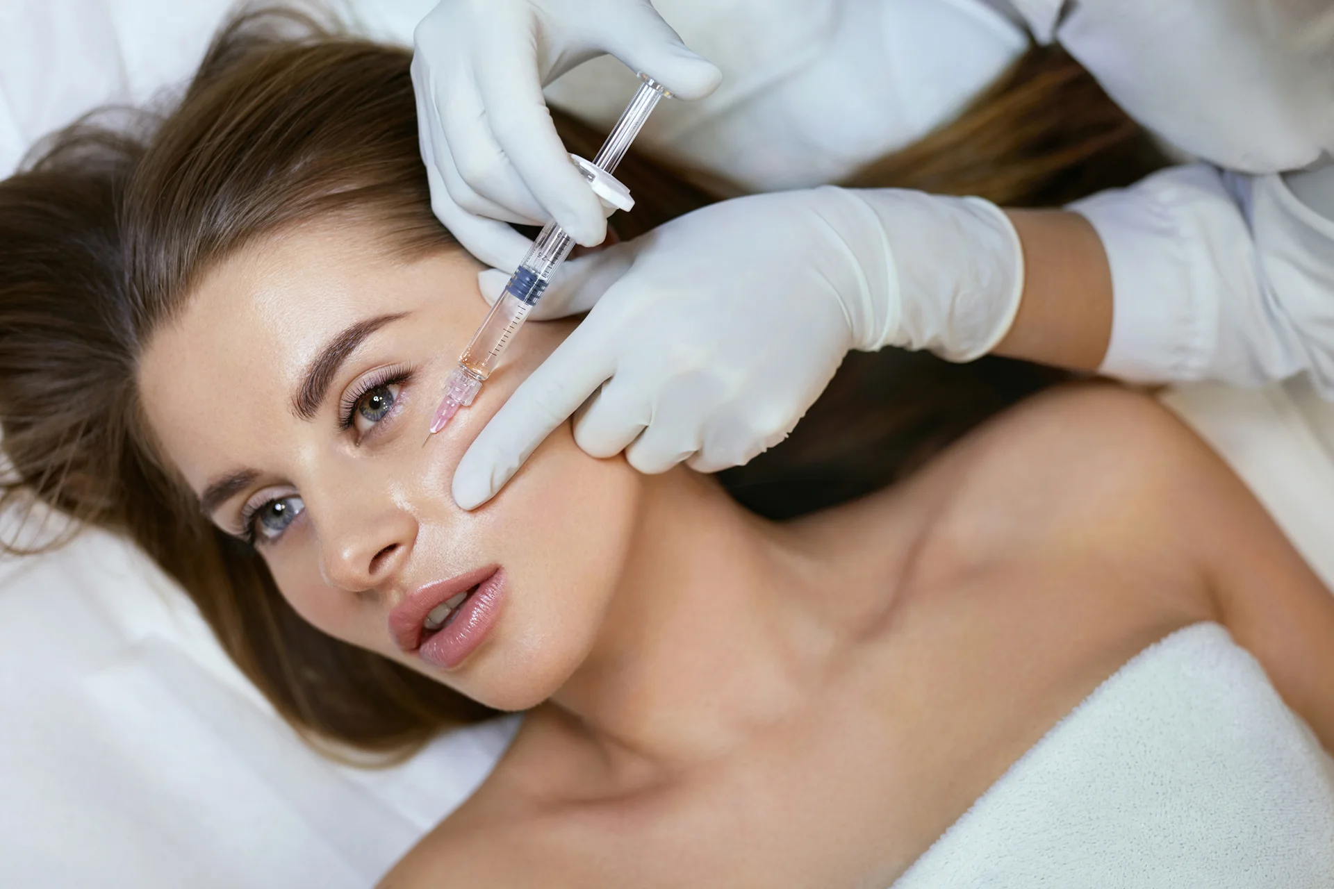A Woman Getting Cheek Filler Treatment||