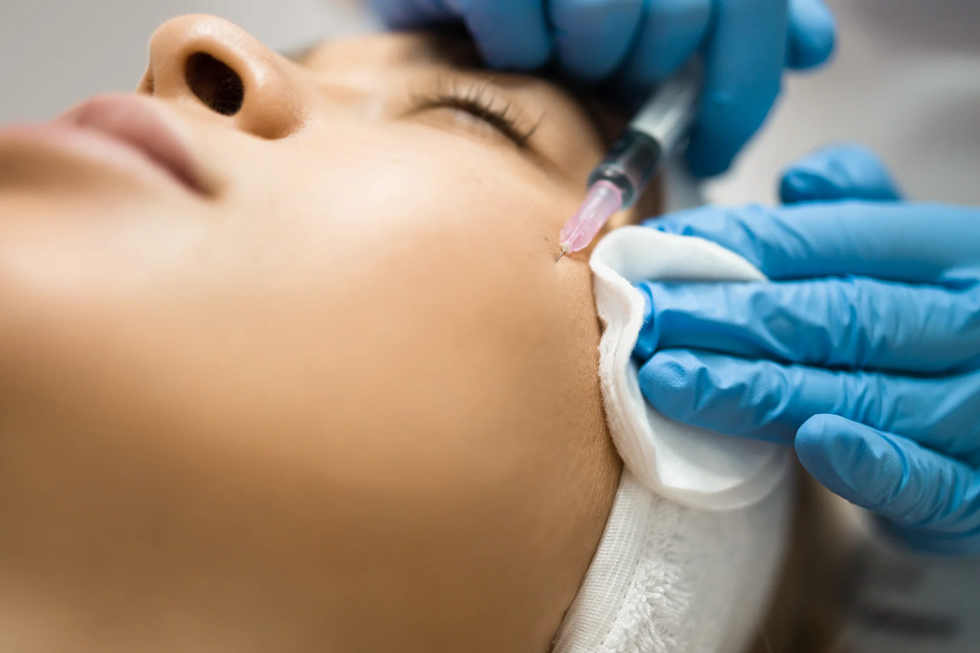 a woman getting cheek filler||