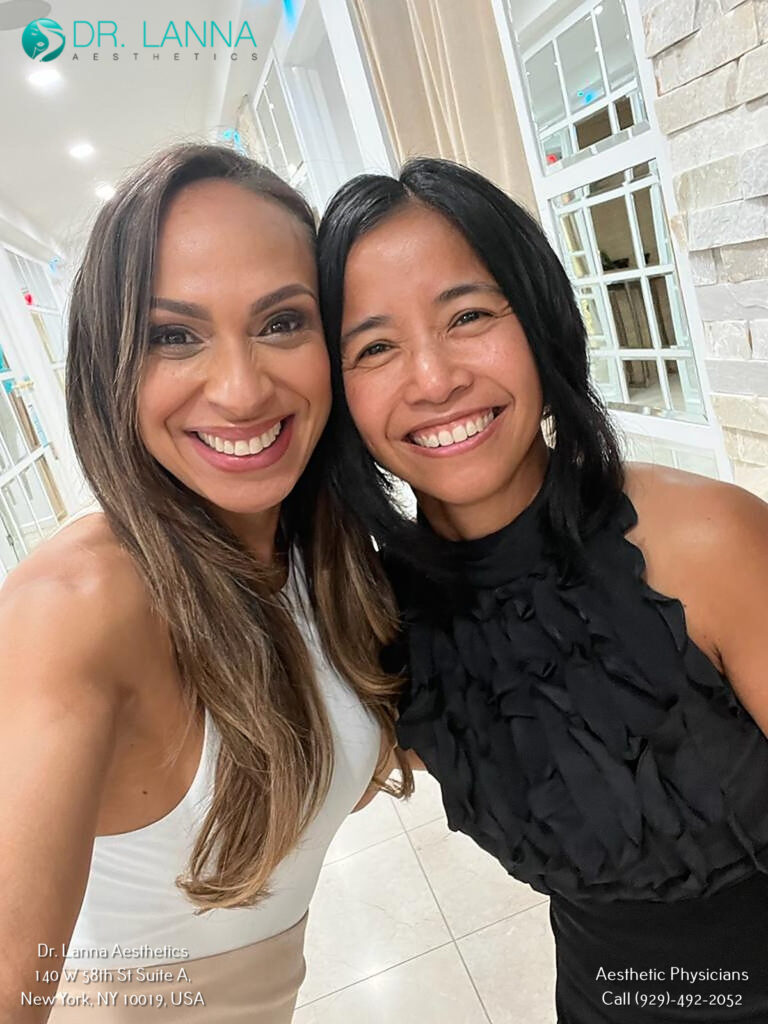 Two women smiling cheek-to-cheek at Dr. Lanna Aesthetics, NYC