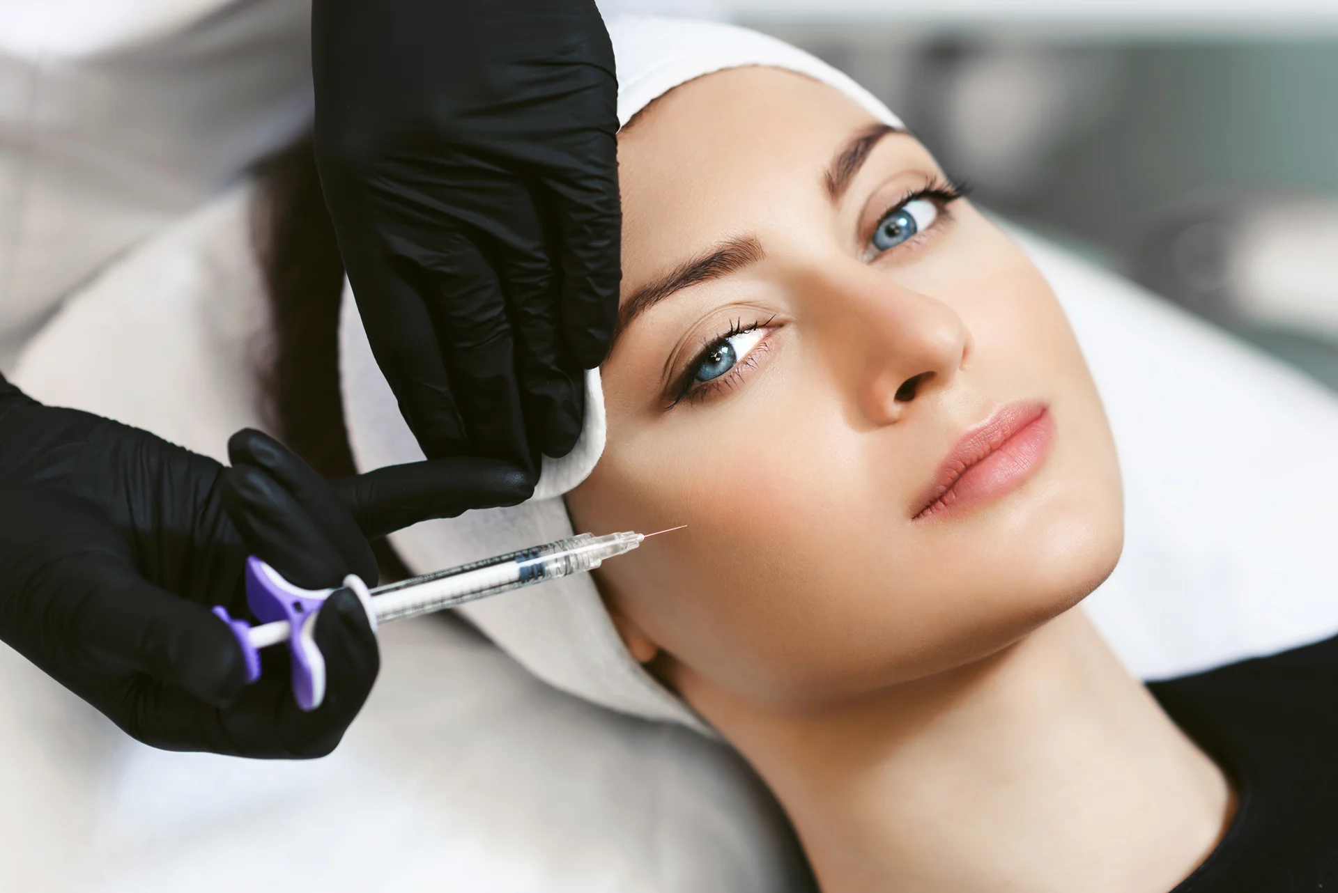 A woman getting cheek bone fillers|||