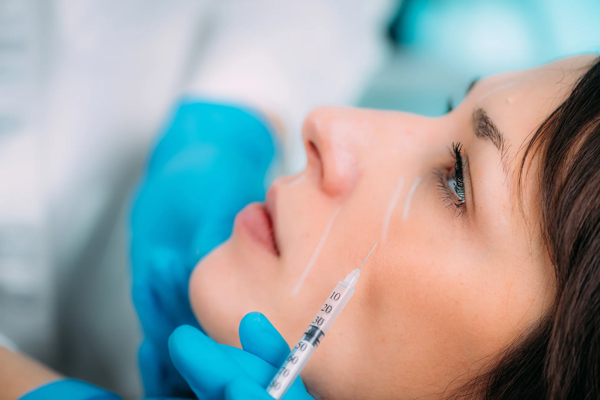 a woman getting cheek fillers||