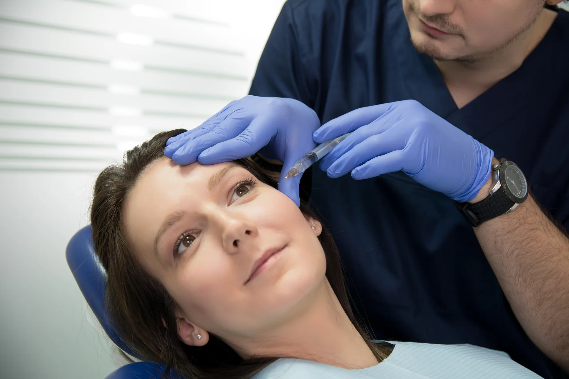 A woman getting cheek fillers||