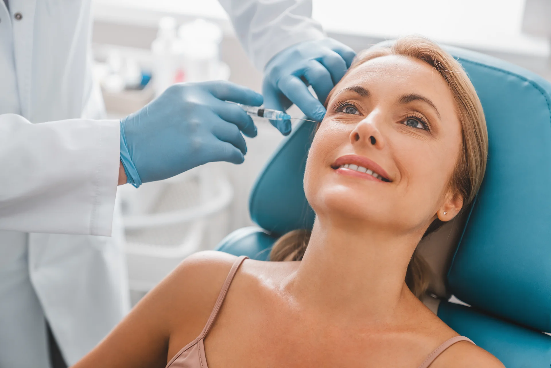 A woman getting cheek filler treatment|||