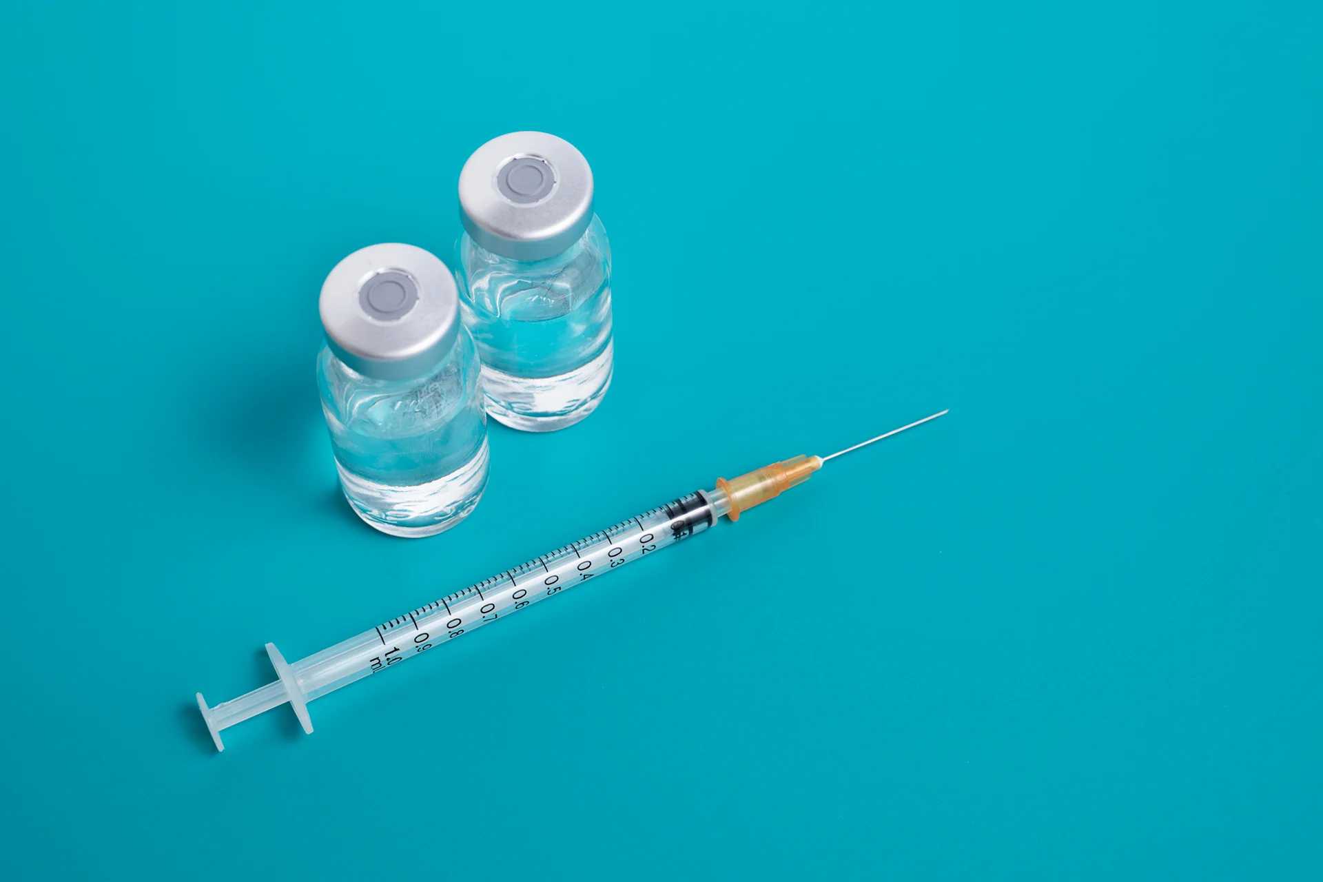 syringe and 2 vials|a young woman gets dermal filler treatment on her nose