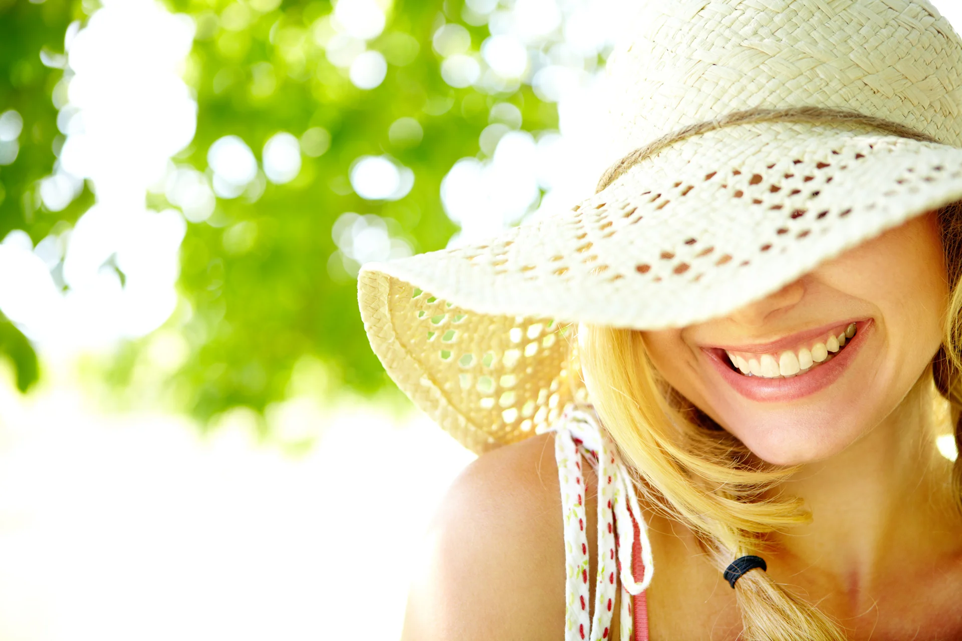 a woman hiding herself from the sun exposure||