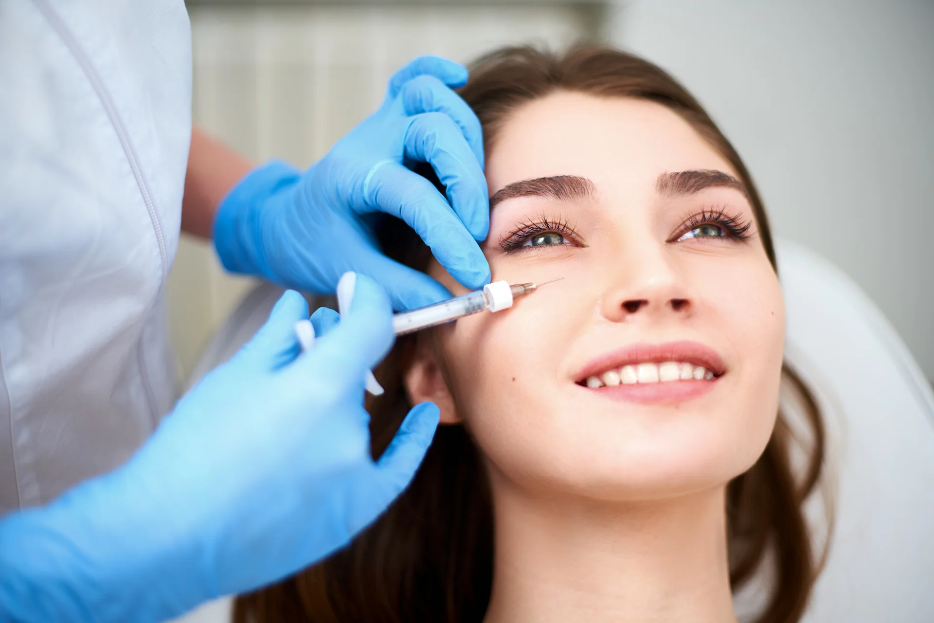 A woman getting cheek filler treatment||||