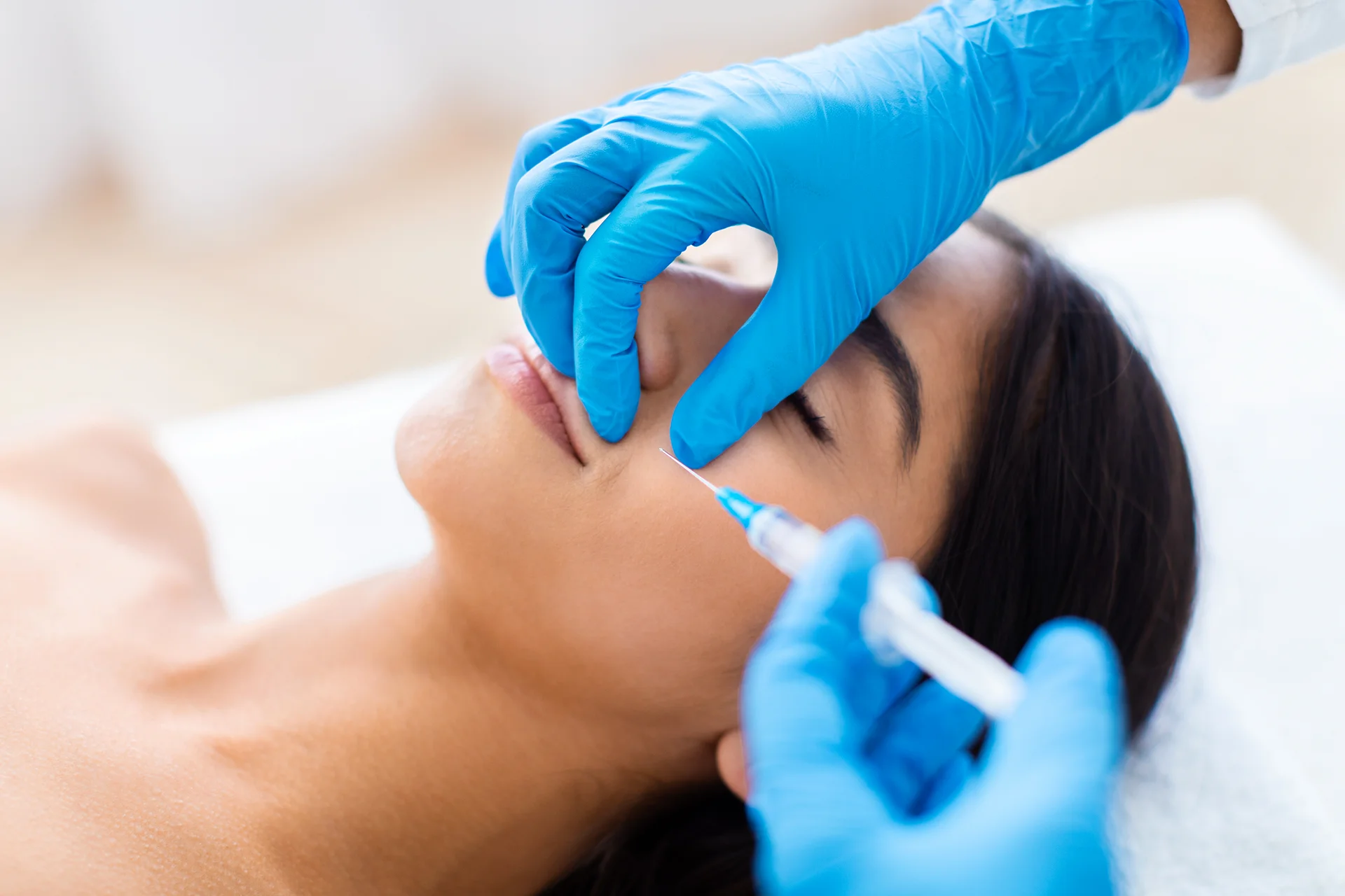 A Woman Getting Cheek Filler Treatment||