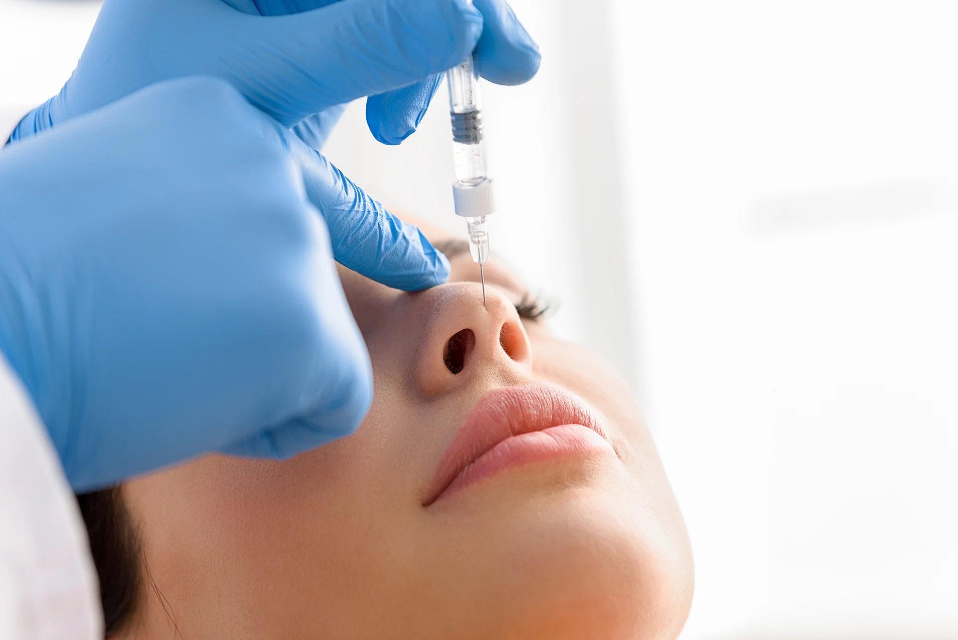 a woman had dermal filler procedure on her nose||