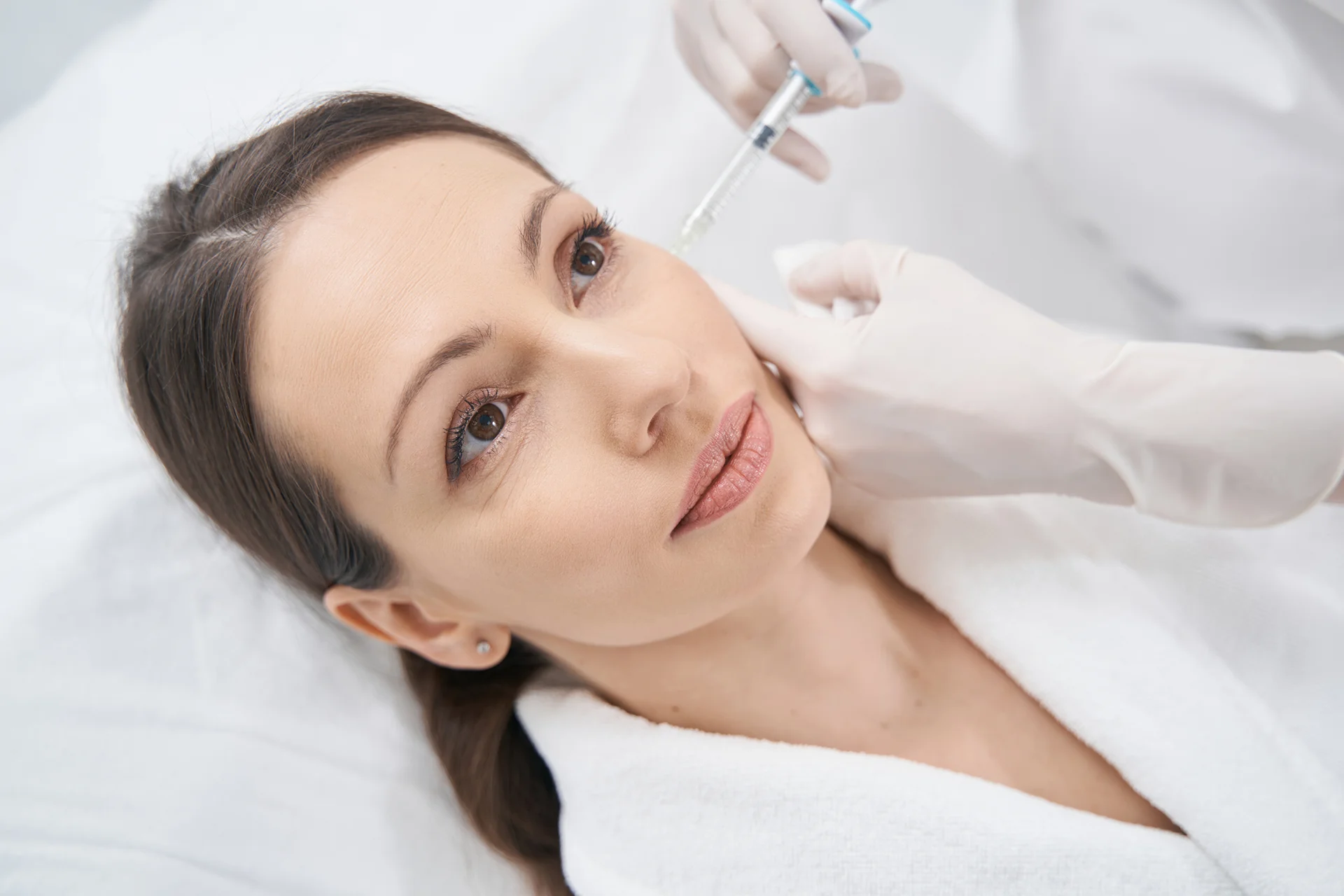a woman received cheek filler injection||