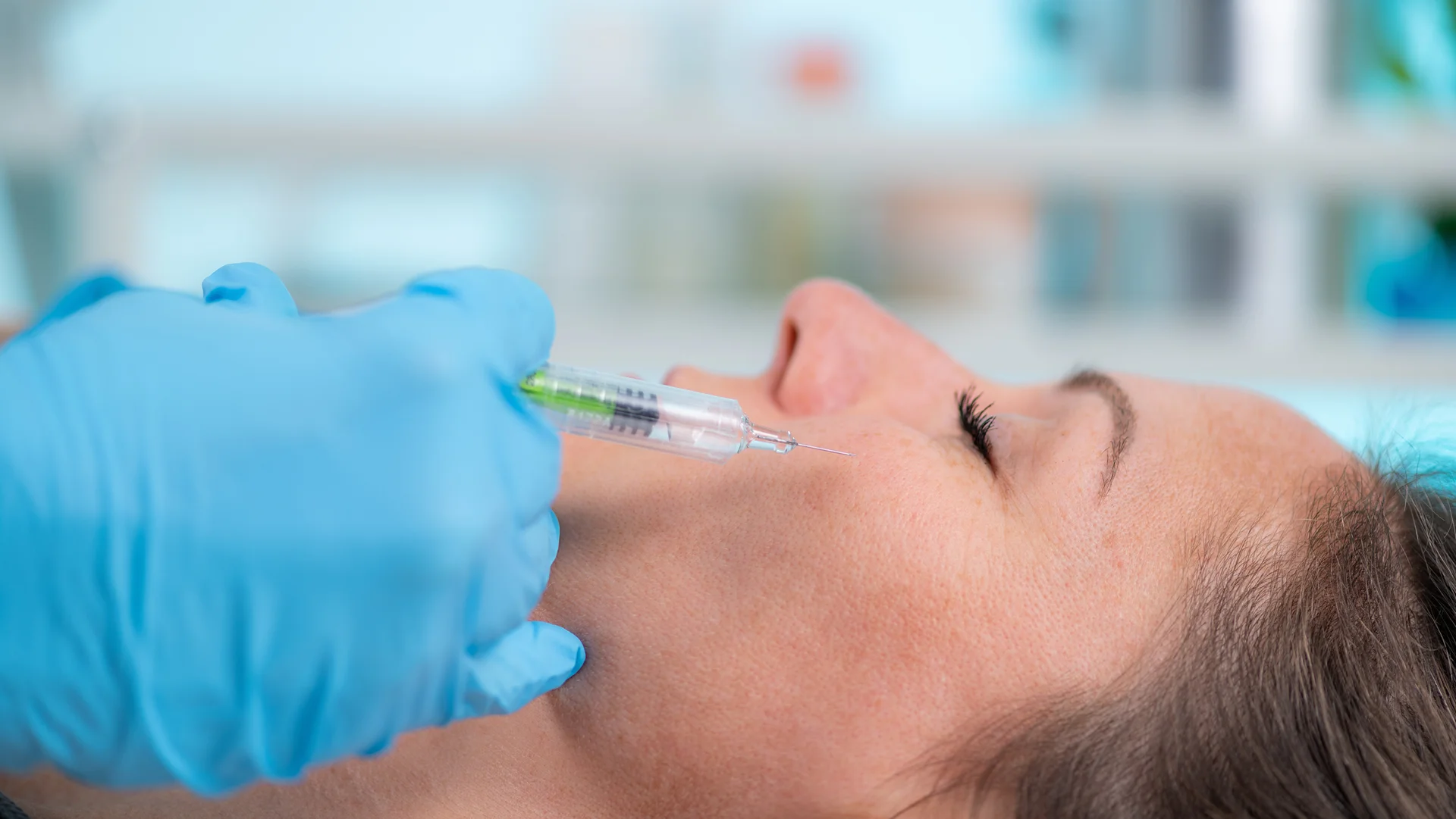 a woman getting cheek fillers||