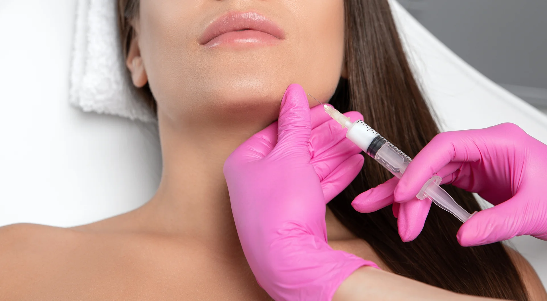 woman who had jaw and chin filler treatment inside a clinic|a woman who had jaw and chin filler treatment in a clinic