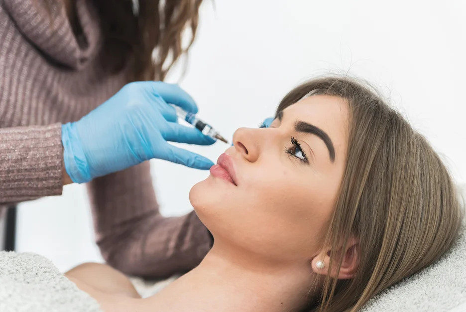 a woman had cheek filler procedure in a beauty clinic