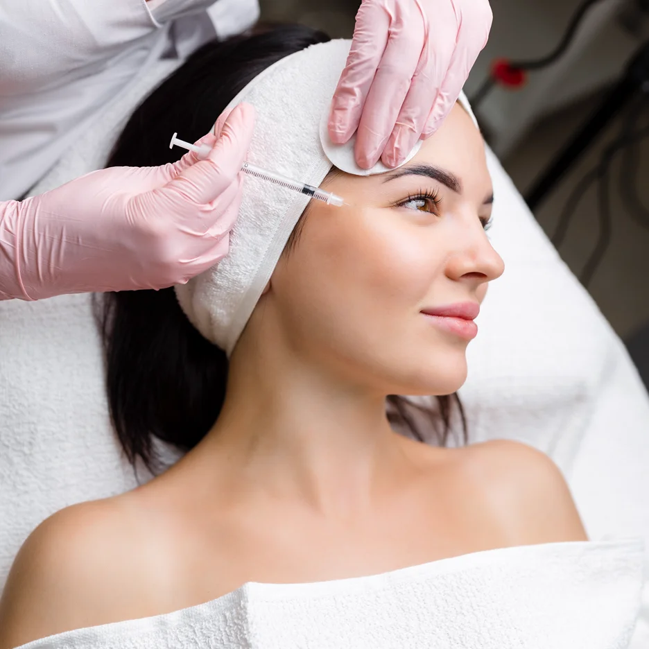 a woman getting cheek fillers