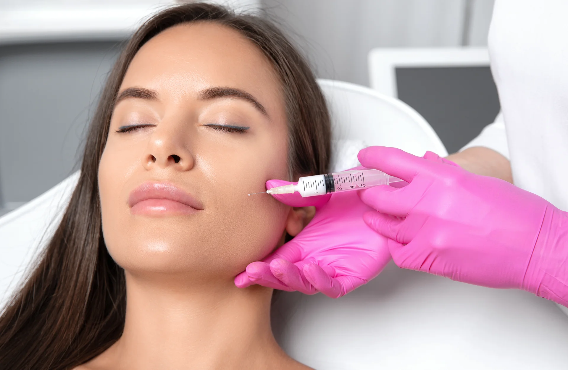 a woman getting cheek fillers||