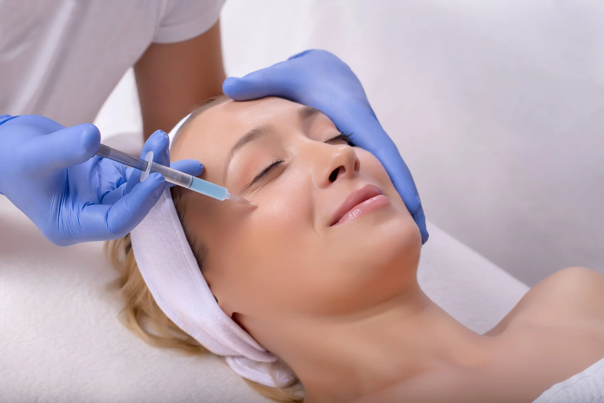 A woman getting cheek filler||