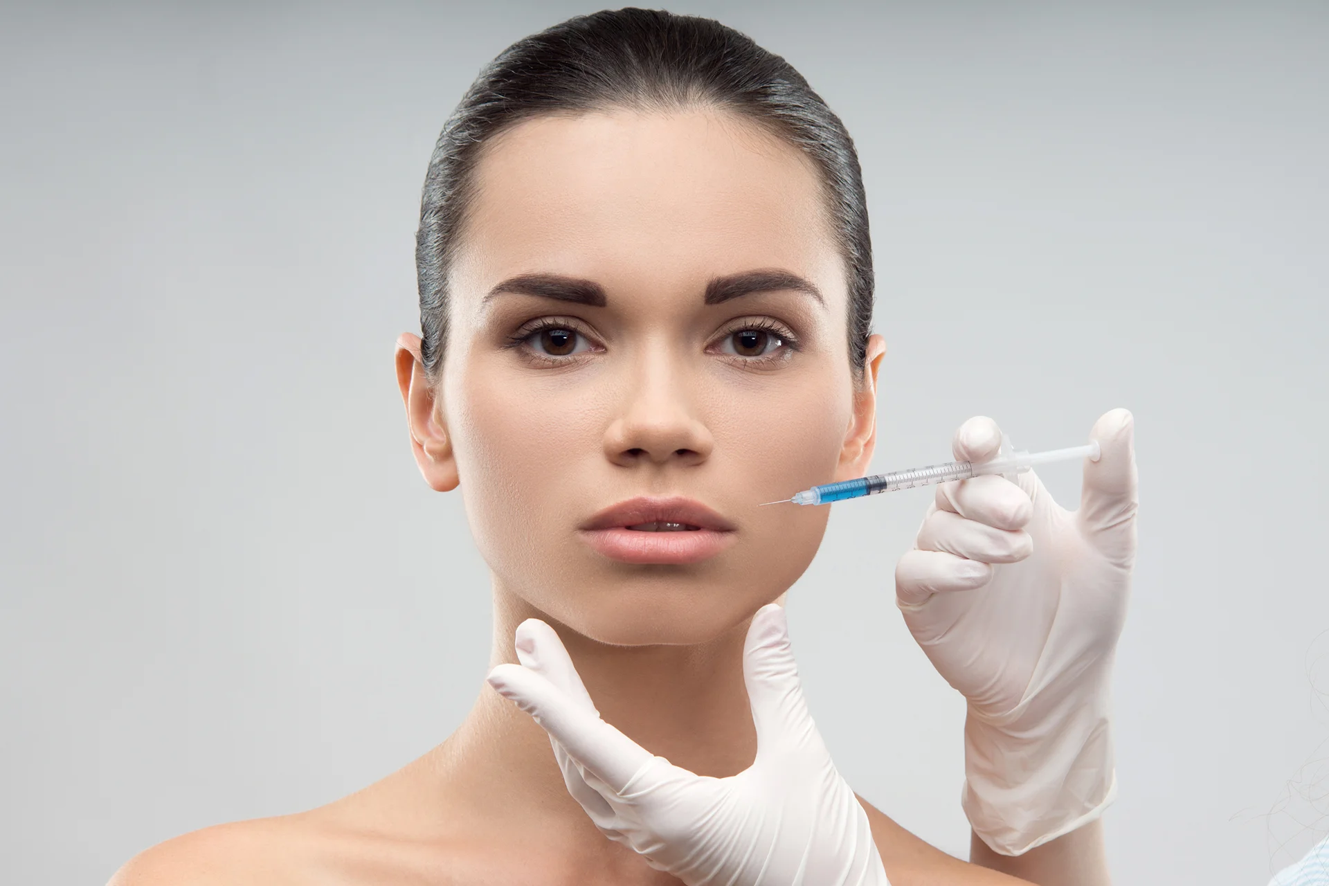 A Woman Getting Cheek Filler Treatment|