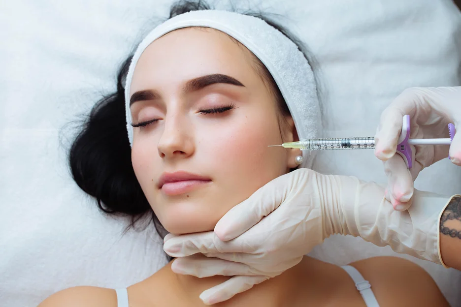 a woman getting cheek fillers