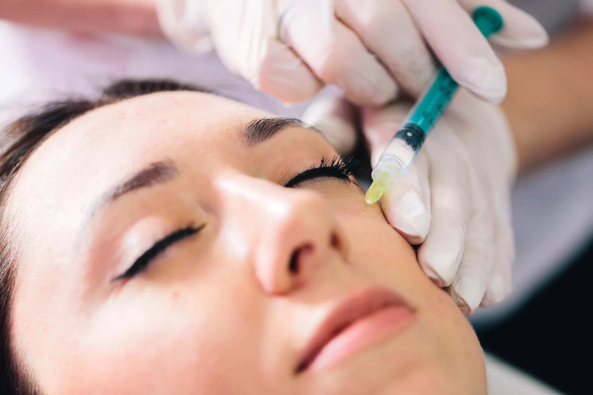 a woman getting cheek fillers|||