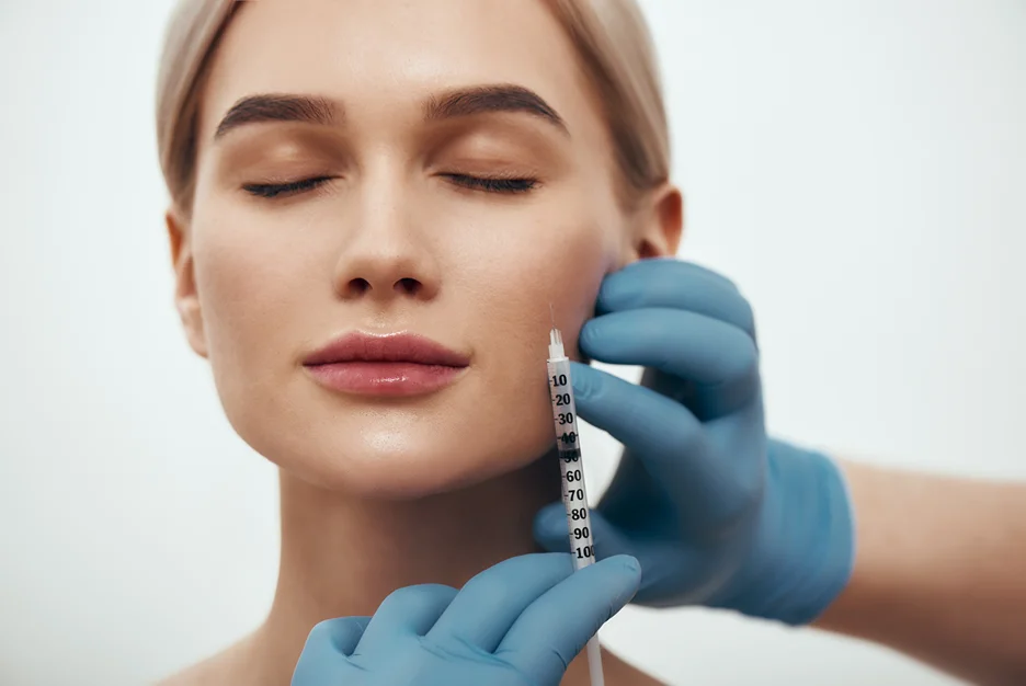 A woman getting cheek filler