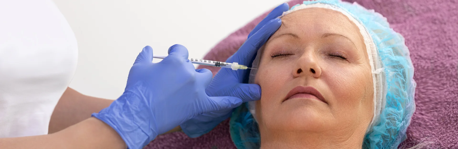 A Woman Getting Cheek Filler Treatment||
