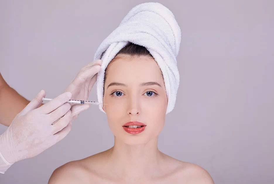 A Woman Geting Cheek Filler Treatment